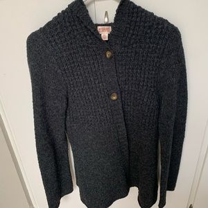 Gray button up sweater.